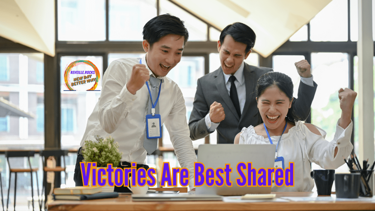 Team cheering in front of computer